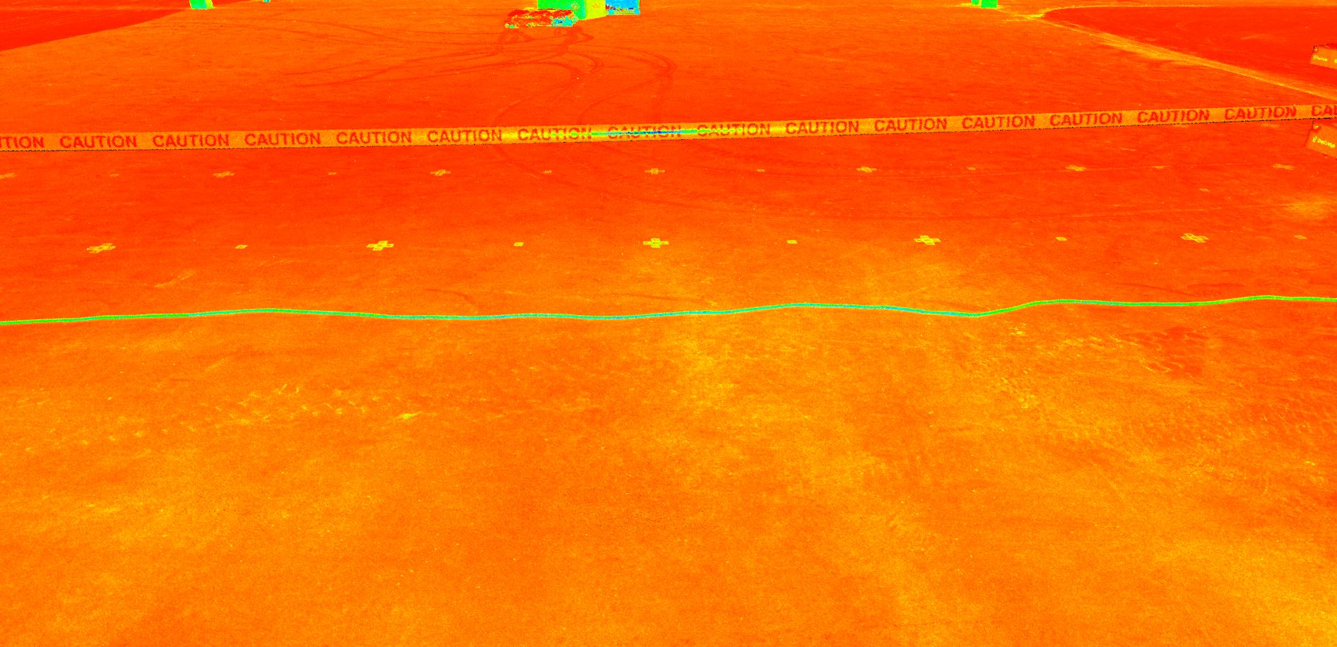 An orange radar scan image of the floor of a warehouse.